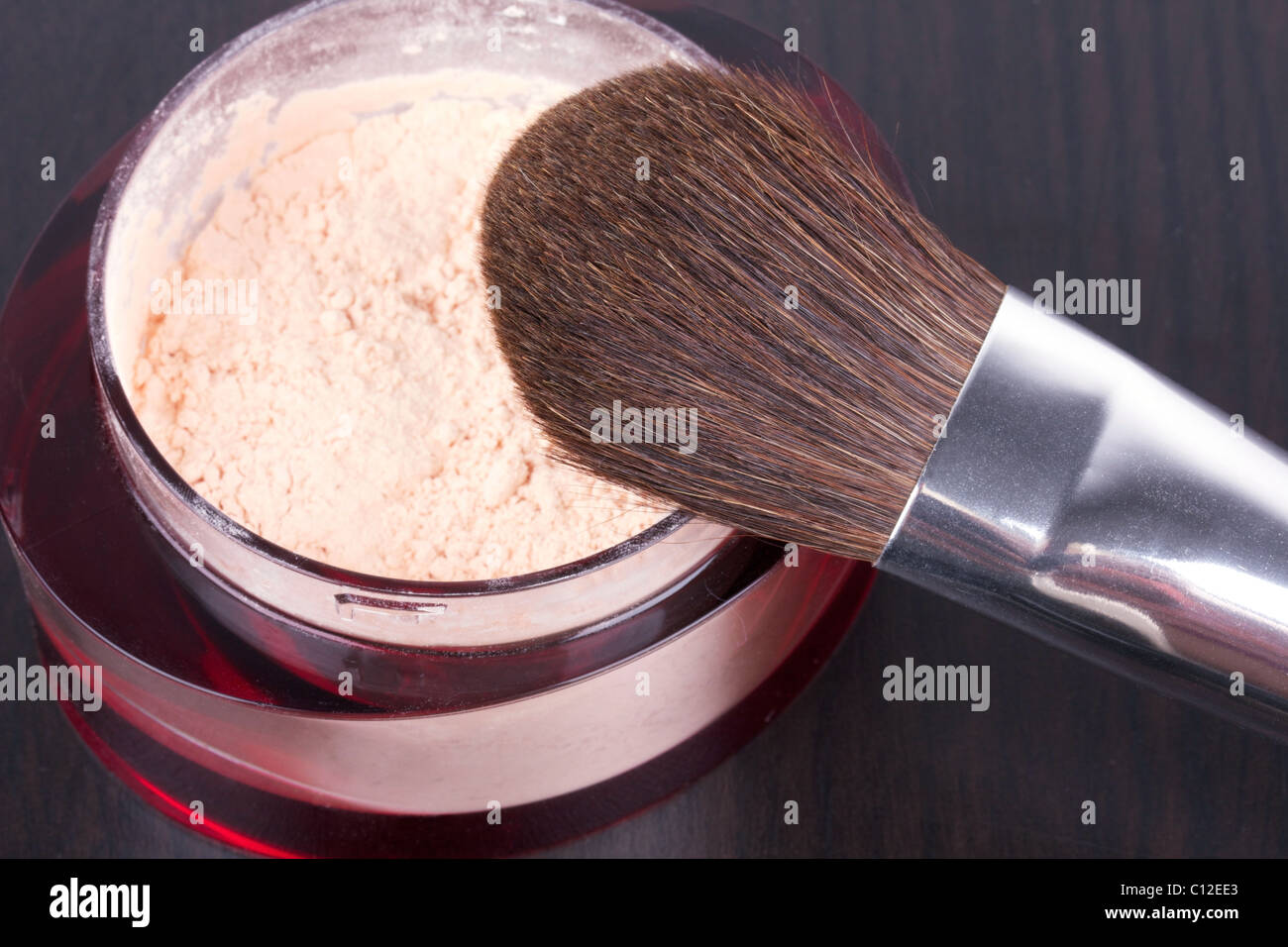 Professional make-up brush on box with powder, closeup Stock Photo