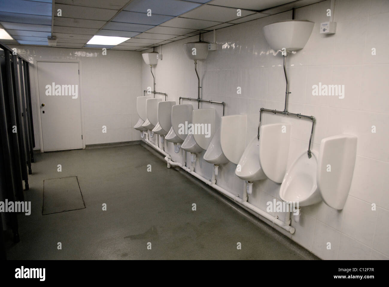 Mens urinals in a row 7 Stock Photo Alamy