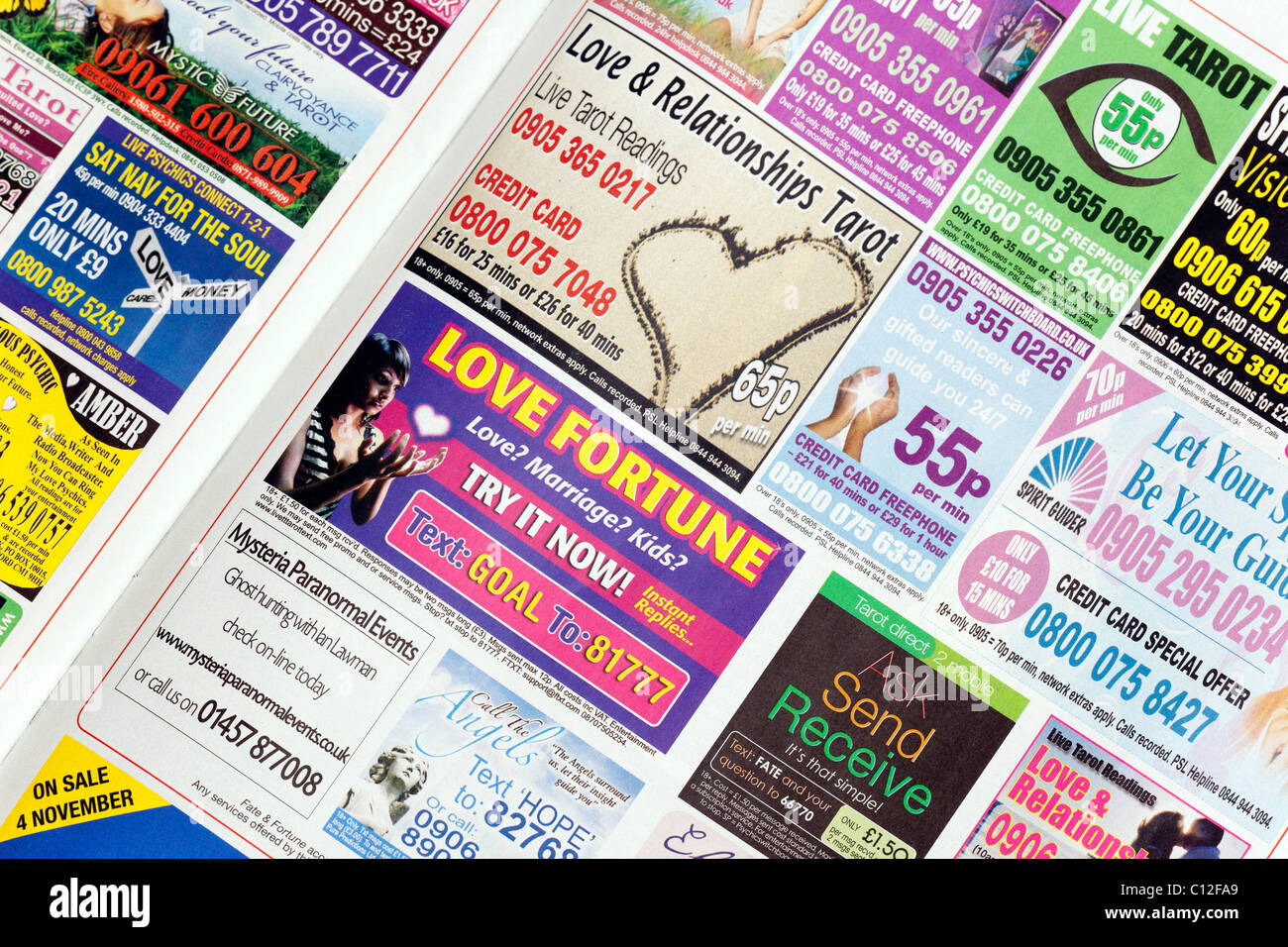 adverts for psychics, clairvoyants, paranormal, tarot and fortune tellers  in a weekly womens magazine in the UK Stock Photo - Alamy
