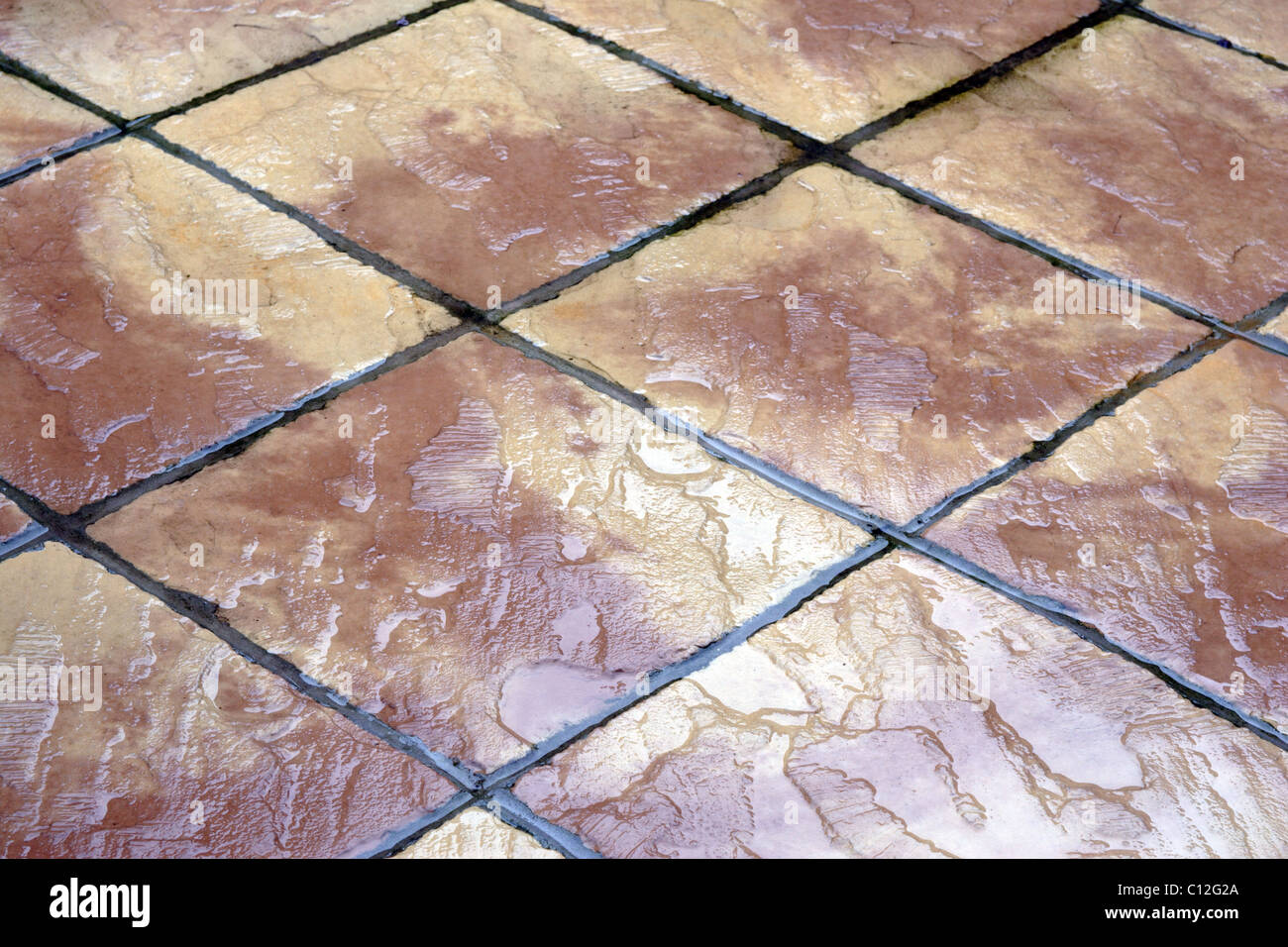Patio slabs in the rain Stock Photo Alamy