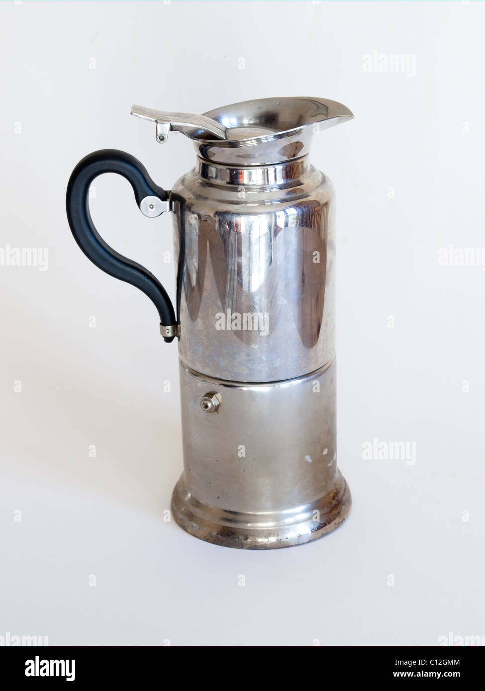 A modern coffee percolator with a high pressure steam chamber on a