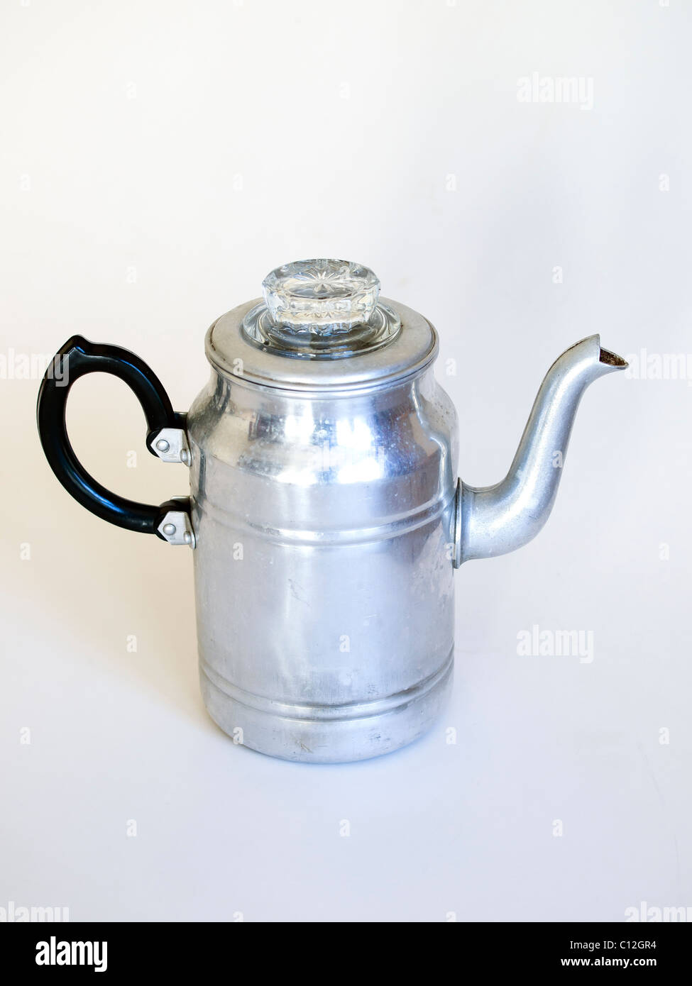 An old aluminium coffee percolator as used in the 1940's 1950's on a white background Stock Photo