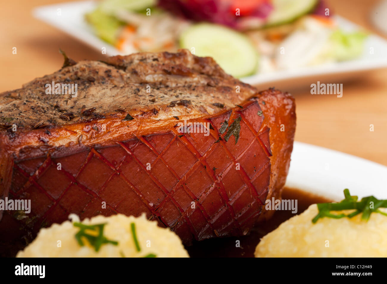 bavarian roast pork dish with potato dumplings Stock Photo Alamy