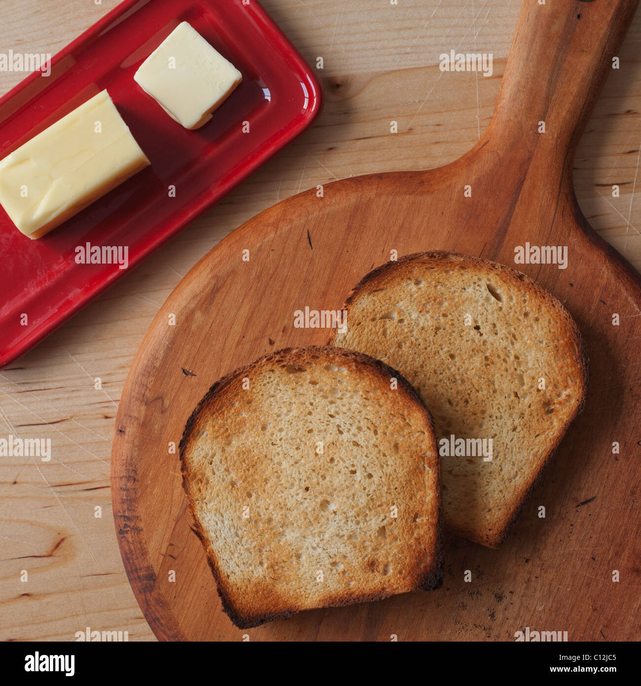 Close up of butter and toasted bread slices on cutting board Stock ...