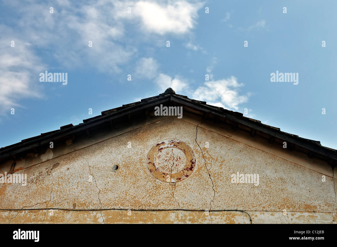 Abandoned neoclassical house roof. Architectural detail. Stock Photo