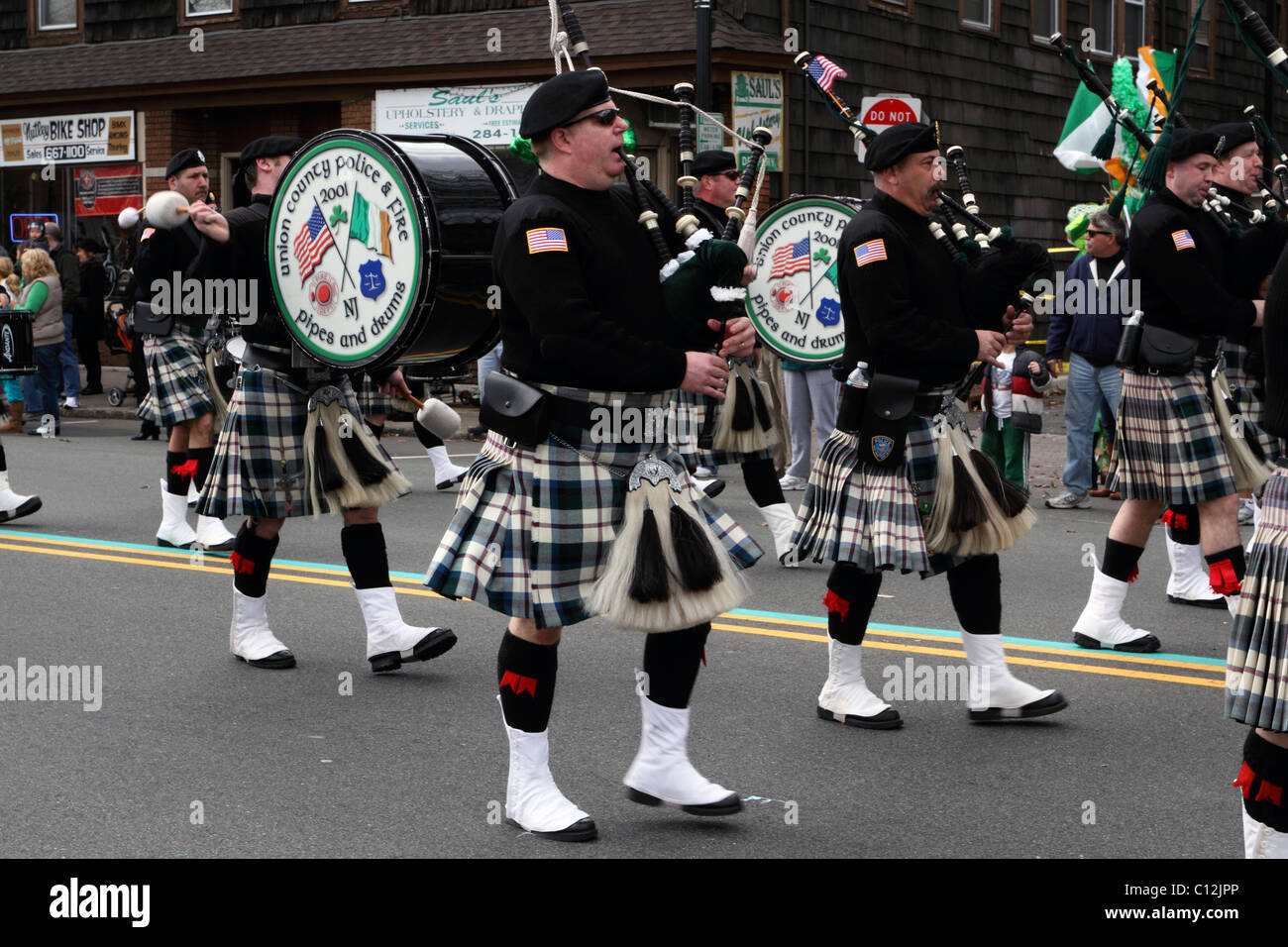 Union County Police and Fire Pipes and Drum corp marching in the local