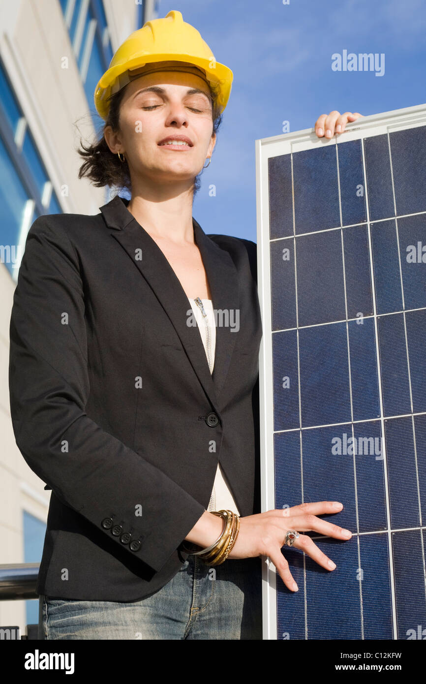 Young woman with a solar panel Stock Photo - Alamy