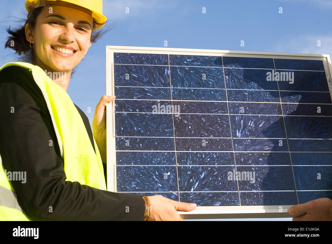 Young woman with a solar panel Stock Photo - Alamy
