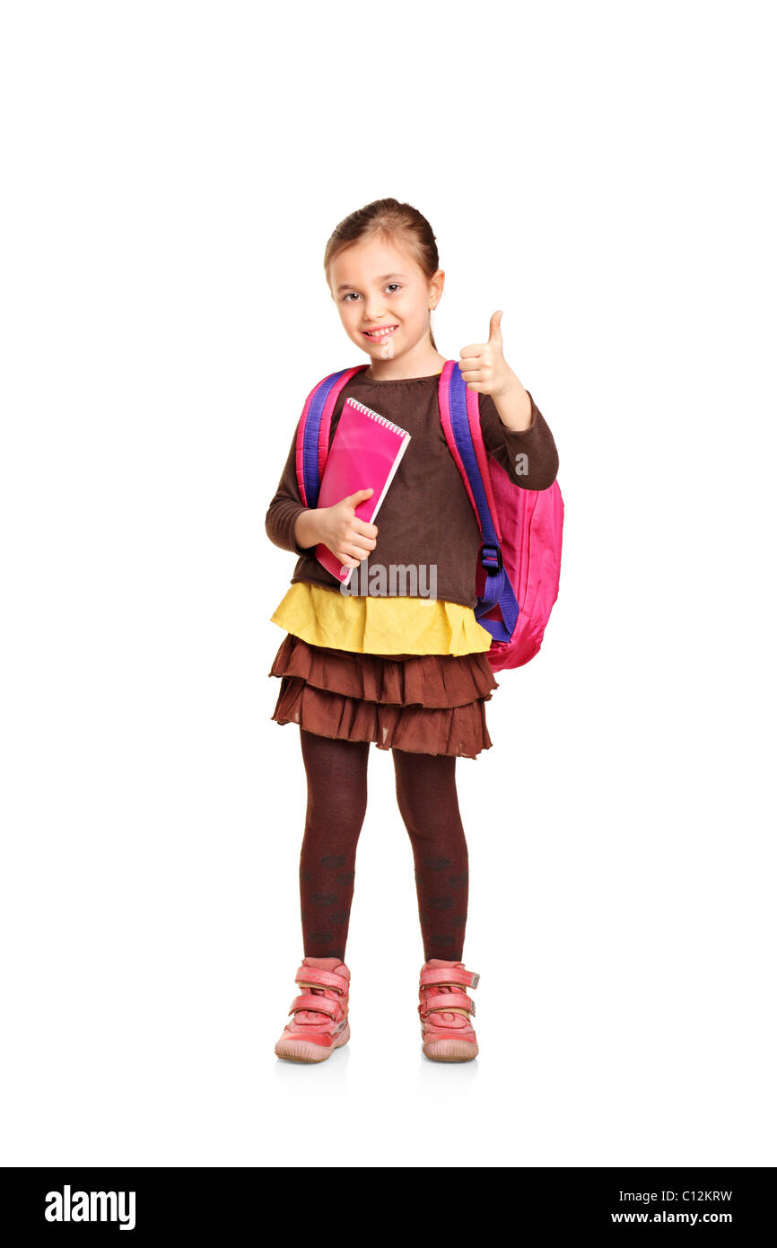 Full length portrait of a school girl with backpack holding book and ...