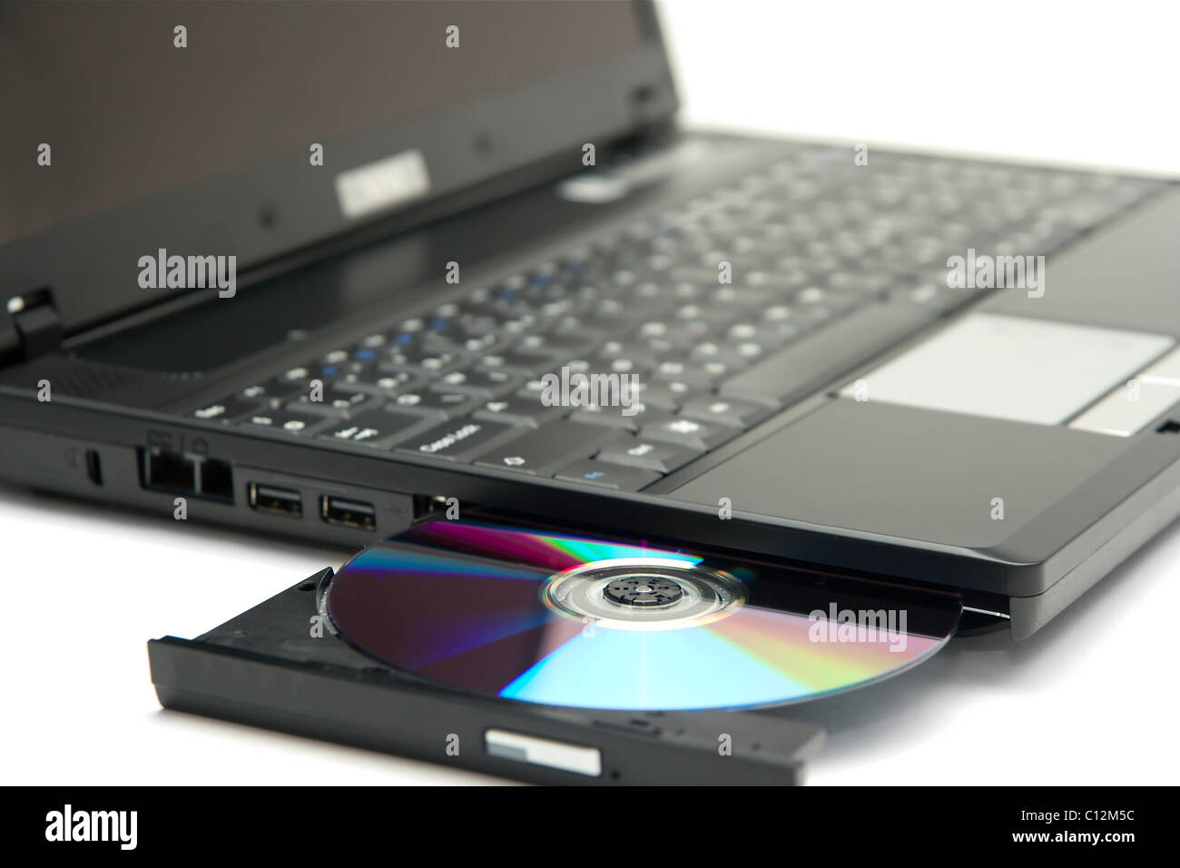 Laptop with a cd in the tray Stock Photo - Alamy