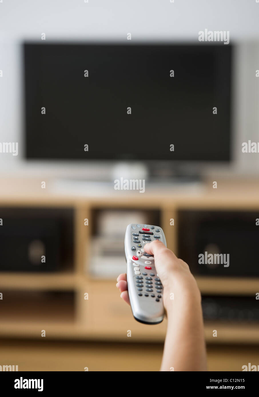 Hand and remote control hi-res stock photography and images - Alamy