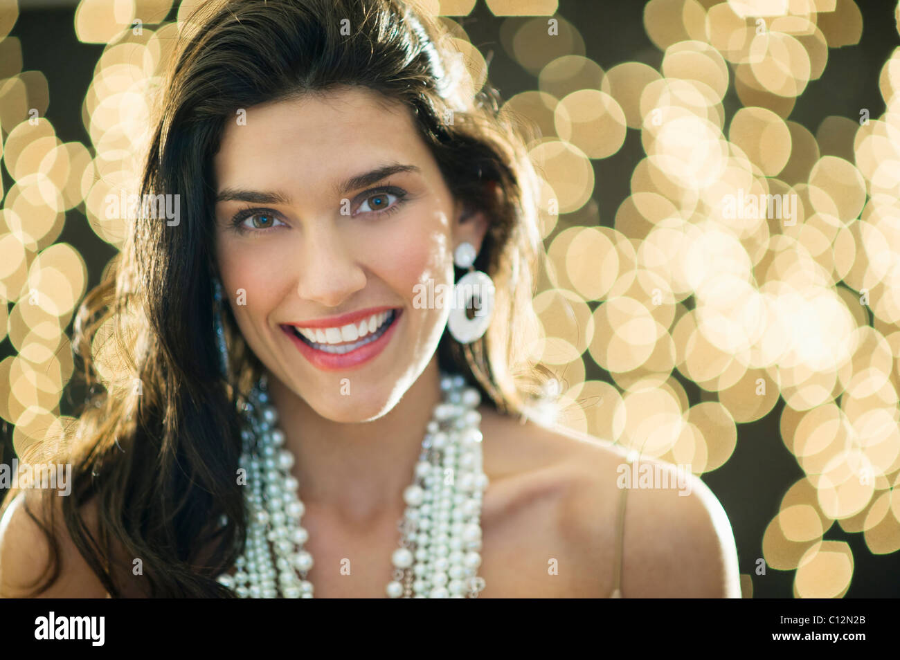 Woman wearing jewelry hi-res stock photography and images - Alamy