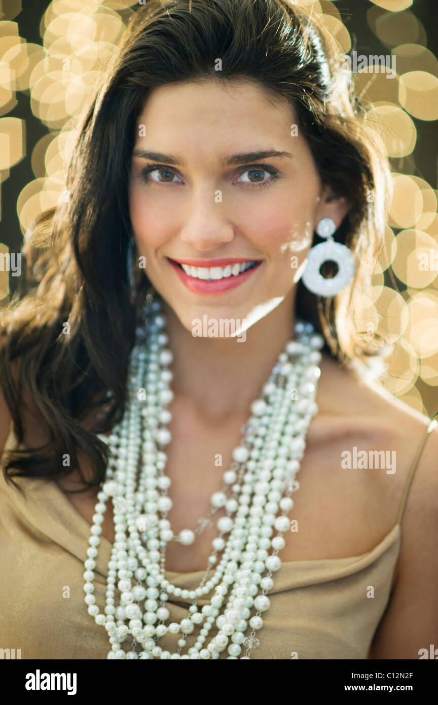 Woman wearing jewelry hi-res stock photography and images - Alamy