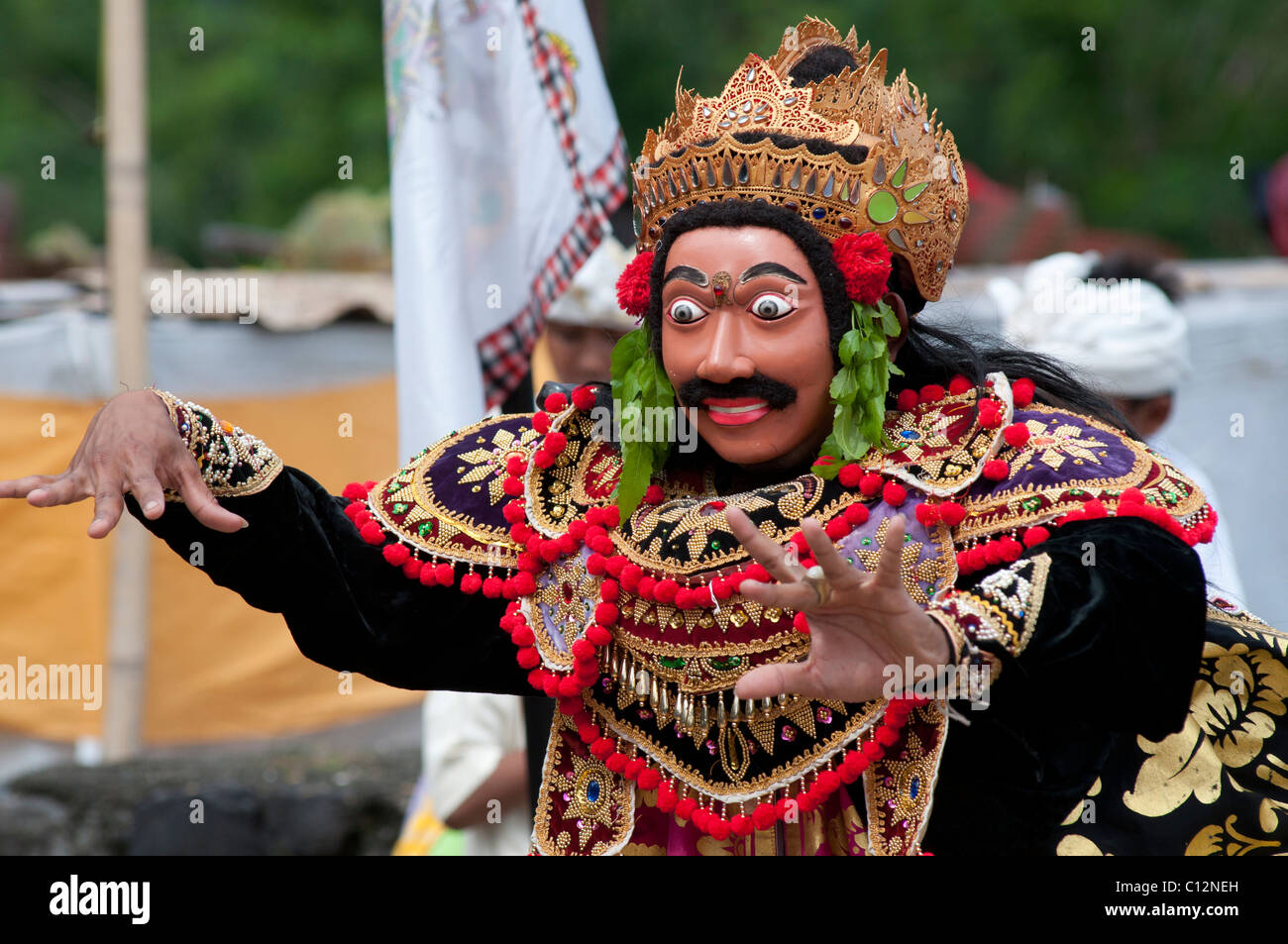 A masked topeng performer at a temple festival in Padang Bai, Bali, Indonesia Stock Photo