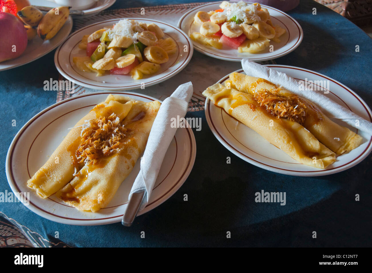 The traditional banana pancake and fruit salad offered as breakfast to