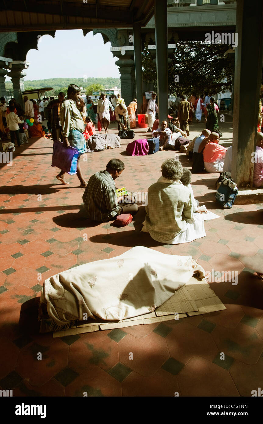 Pilgrims in the courtyard of a temple, Tirumala Venkateswara Temple, Tirumala, Tirupati, Chittoor, Andhra Pradesh, India Stock Photo