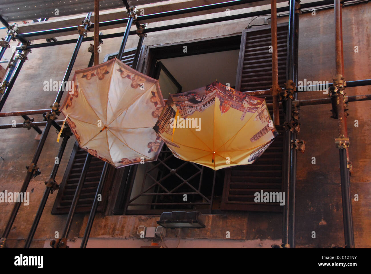 Umbrellas hang from balcony window in Rome, Italy Stock Photo Alamy