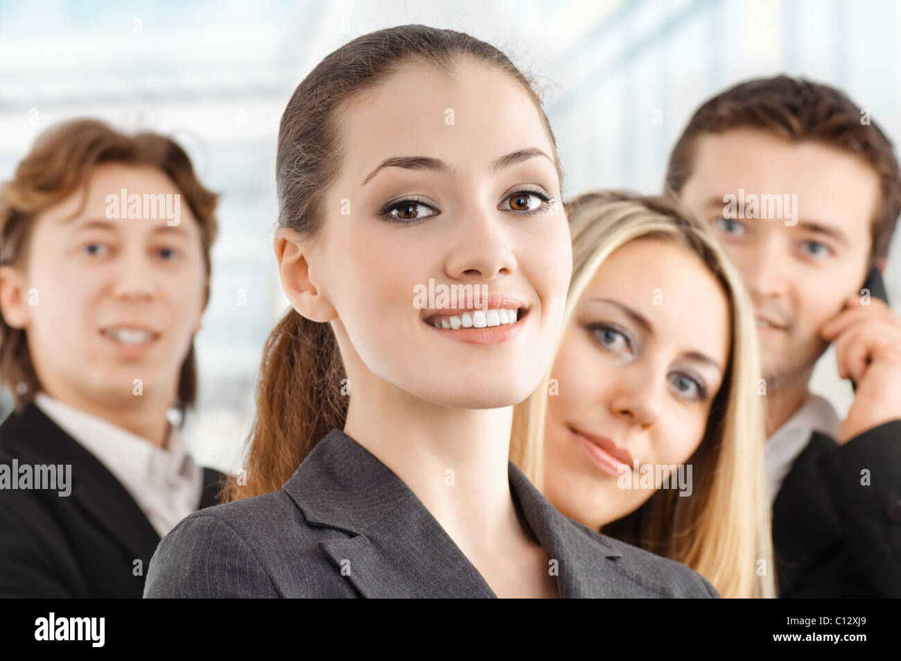 team of successful smiling young business people Stock Photo - Alamy