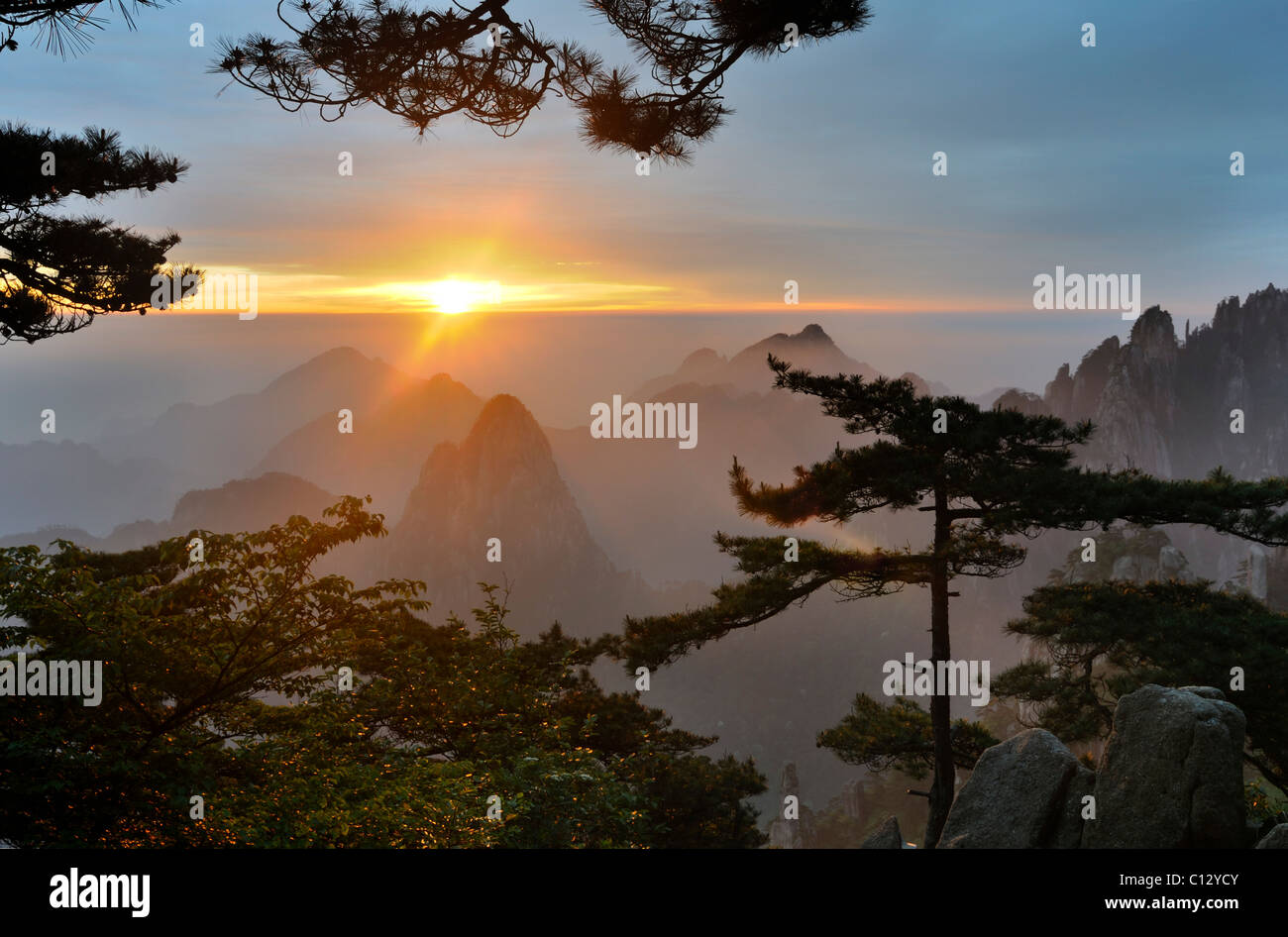 sun rising over Huangshan Mountains in Anhui province of China Stock Photo