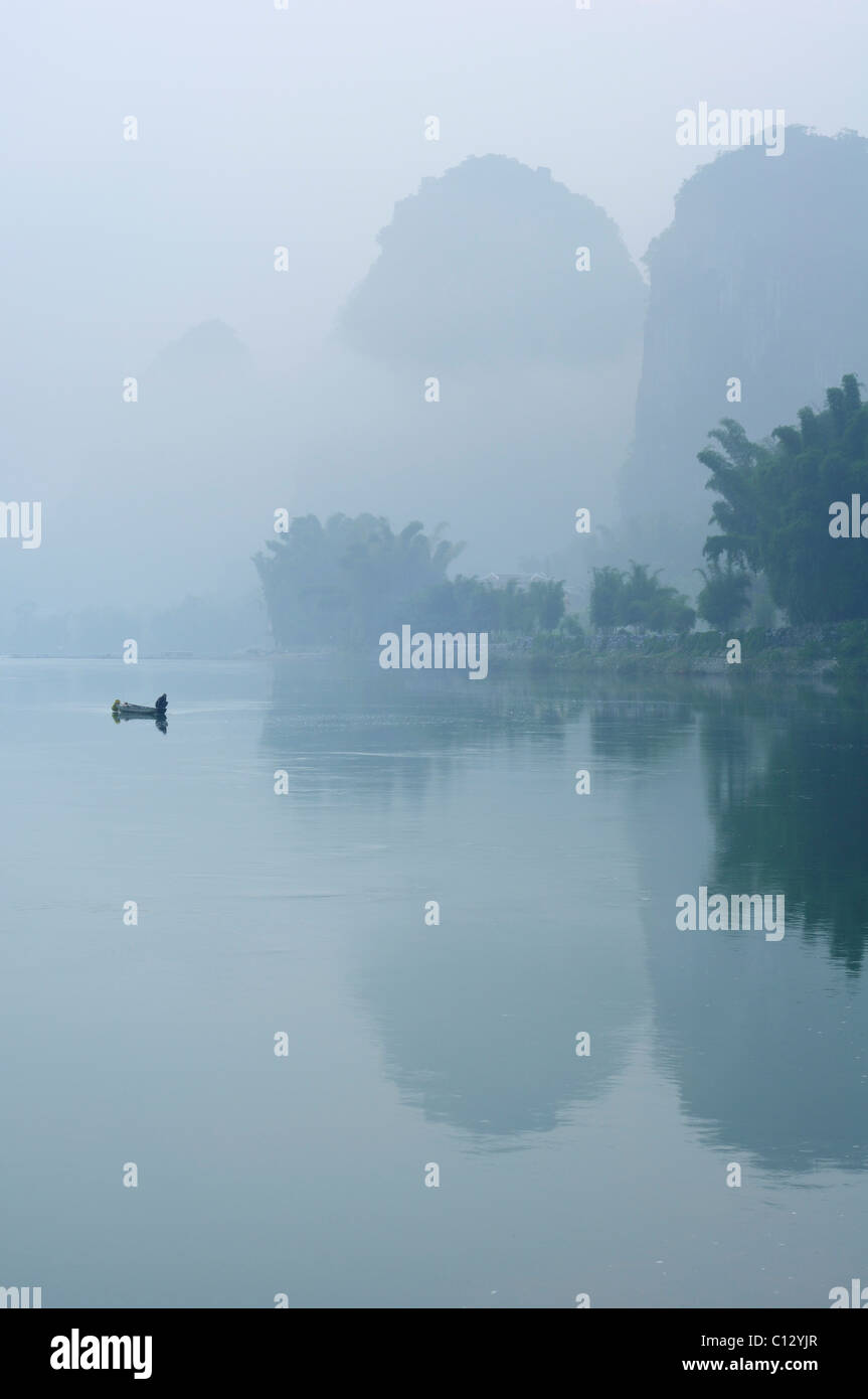 fisherman on Li Rivernear Yangshuo in Guilin region of China Stock Photo