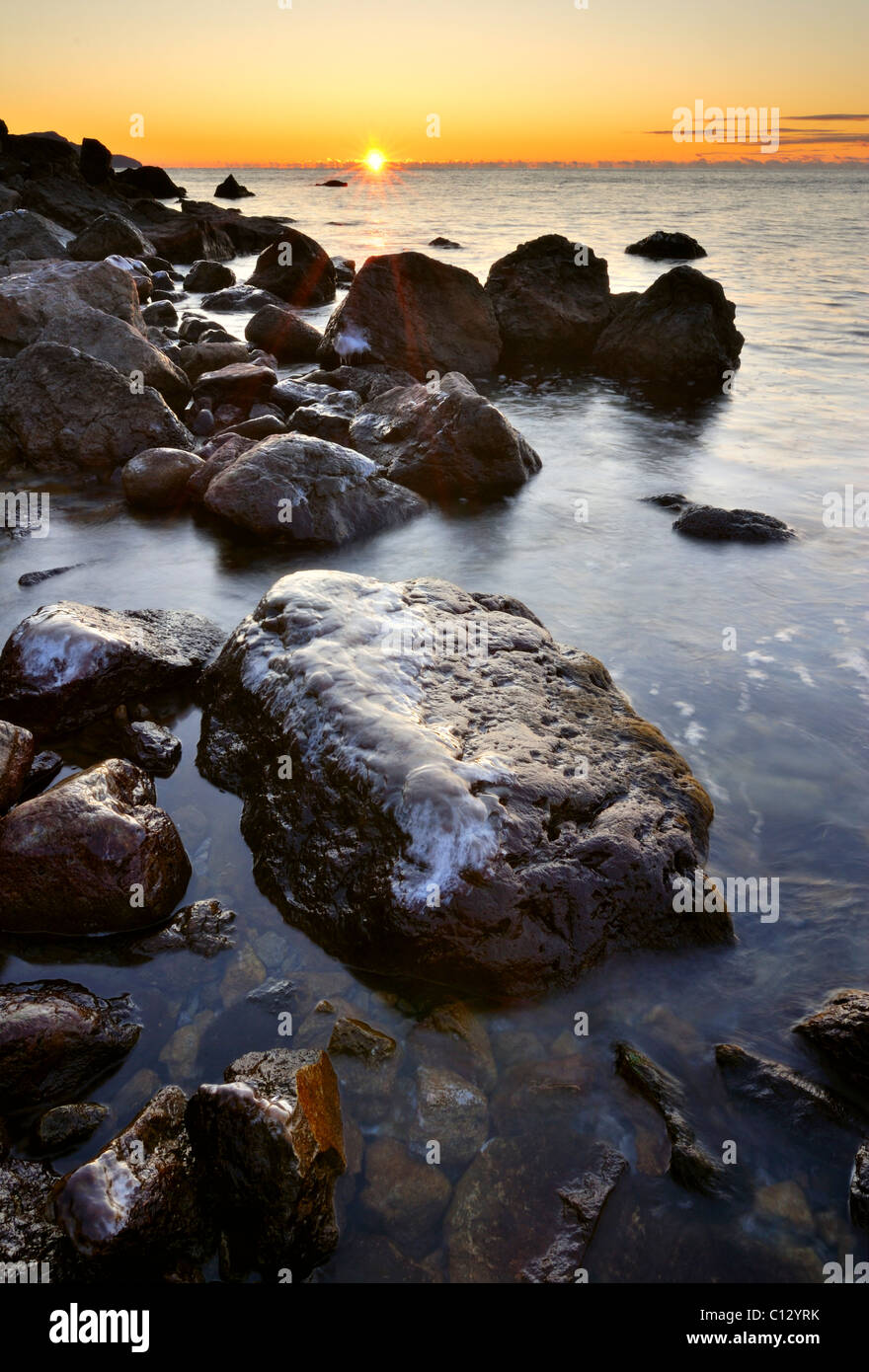 ice covered rocks on crimean black sea coast at robber bay Stock Photo