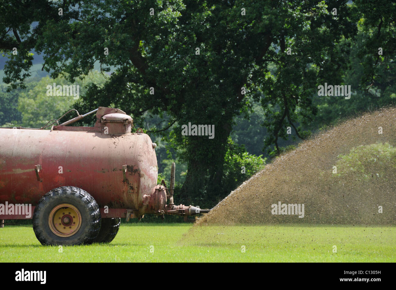 Farmer muck spreading Stock Photo Alamy