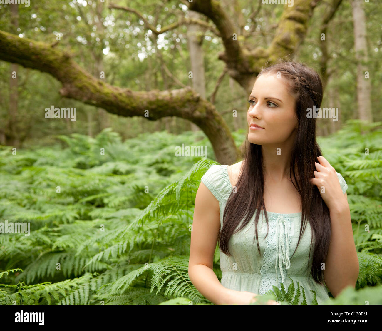 portrait of young woman in forest Stock Photo - Alamy
