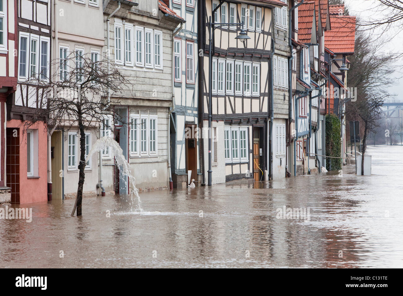 Flooded street and houses on the river Werra, caused by melting snow, Hann. Muenden, Lower Saxony, Germany Stock Photo