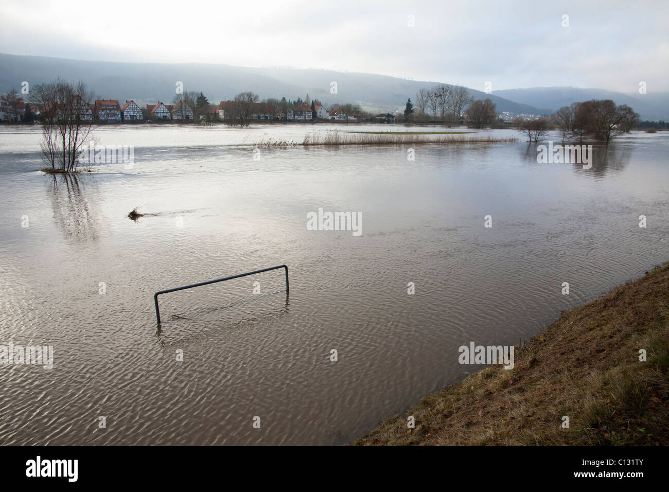 Flood water from melting snow, on the river Weser, Lower Saxony, Germany Stock Photo