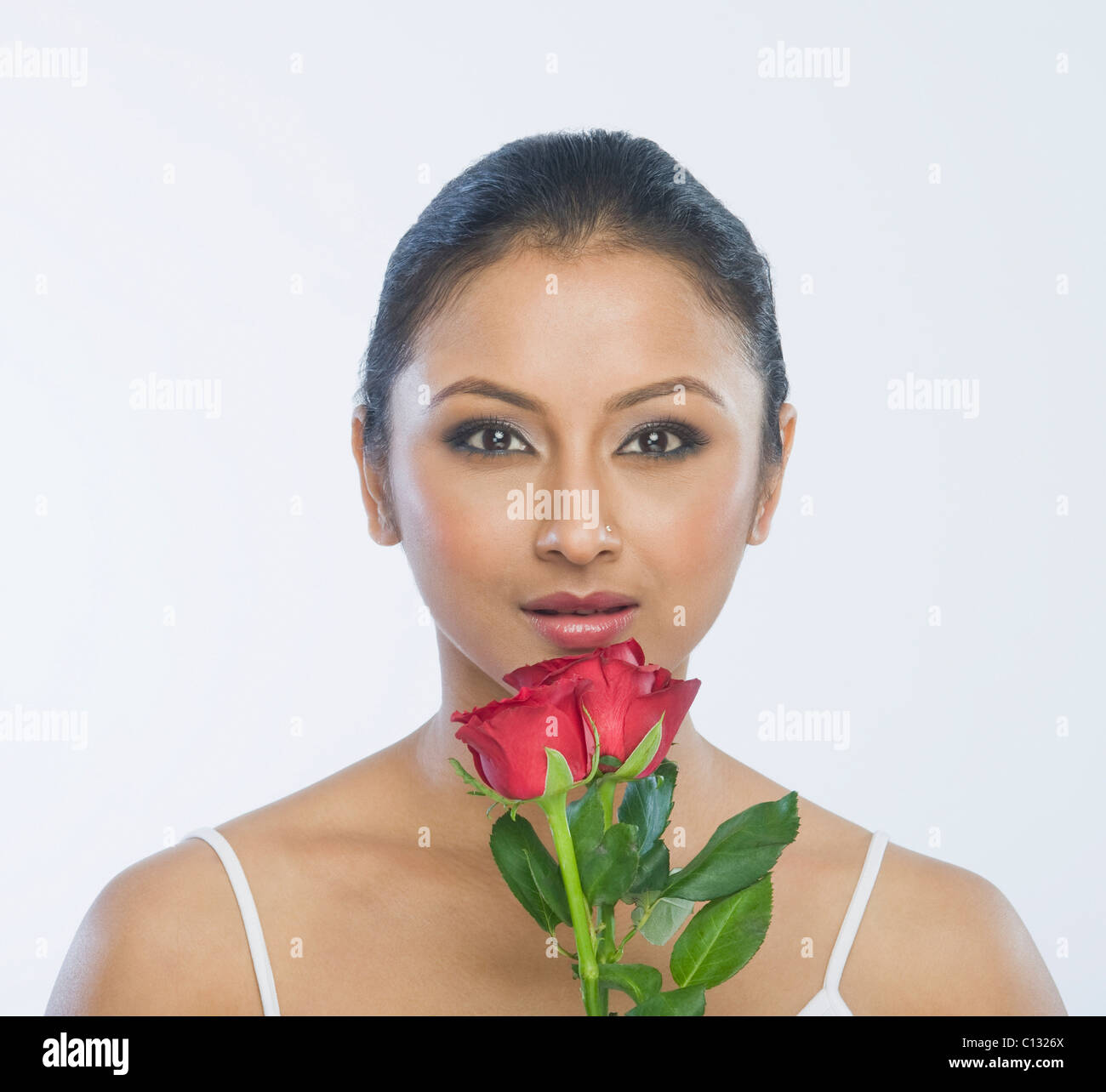 Portrait of a woman with red roses Stock Photo - Alamy