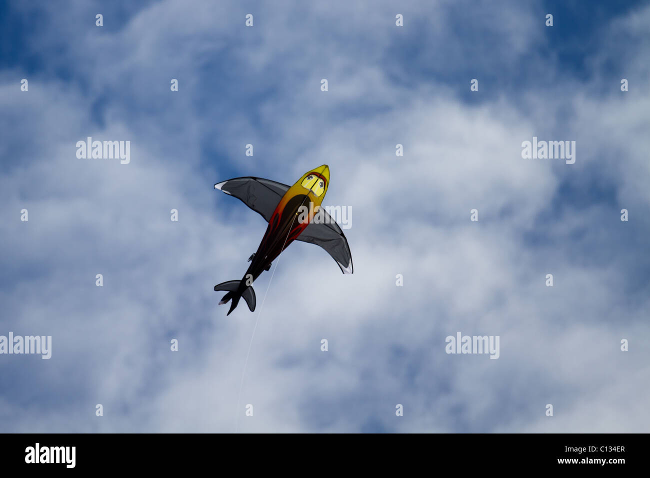 A shark kite flying in the air on a lovely summers day Stock Photo Alamy
