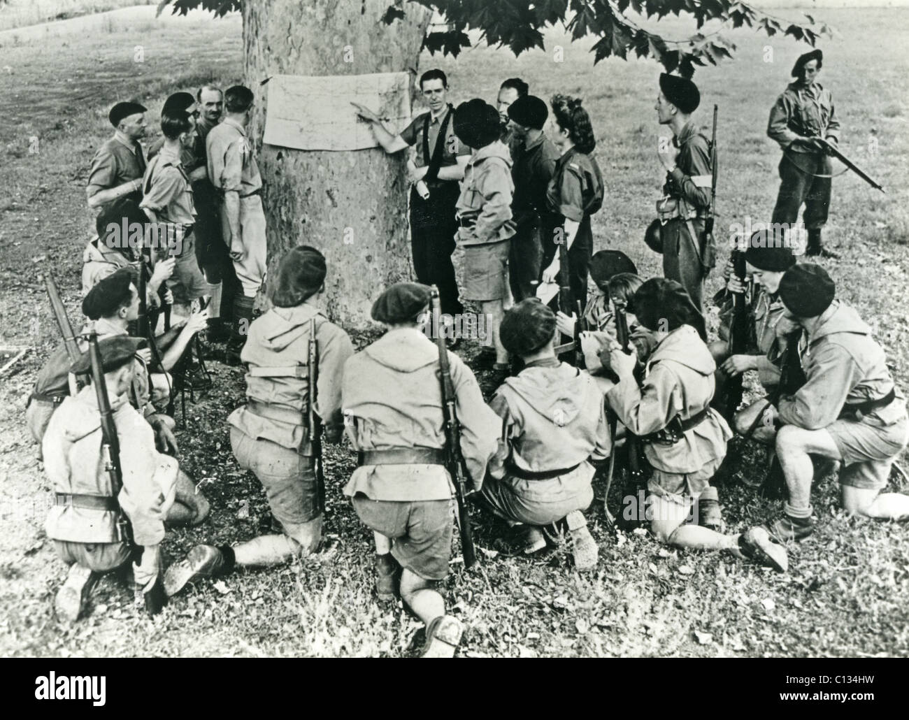 FRENCH MAQUIS resistance unit is briefed on operations in 1944 Stock Photo