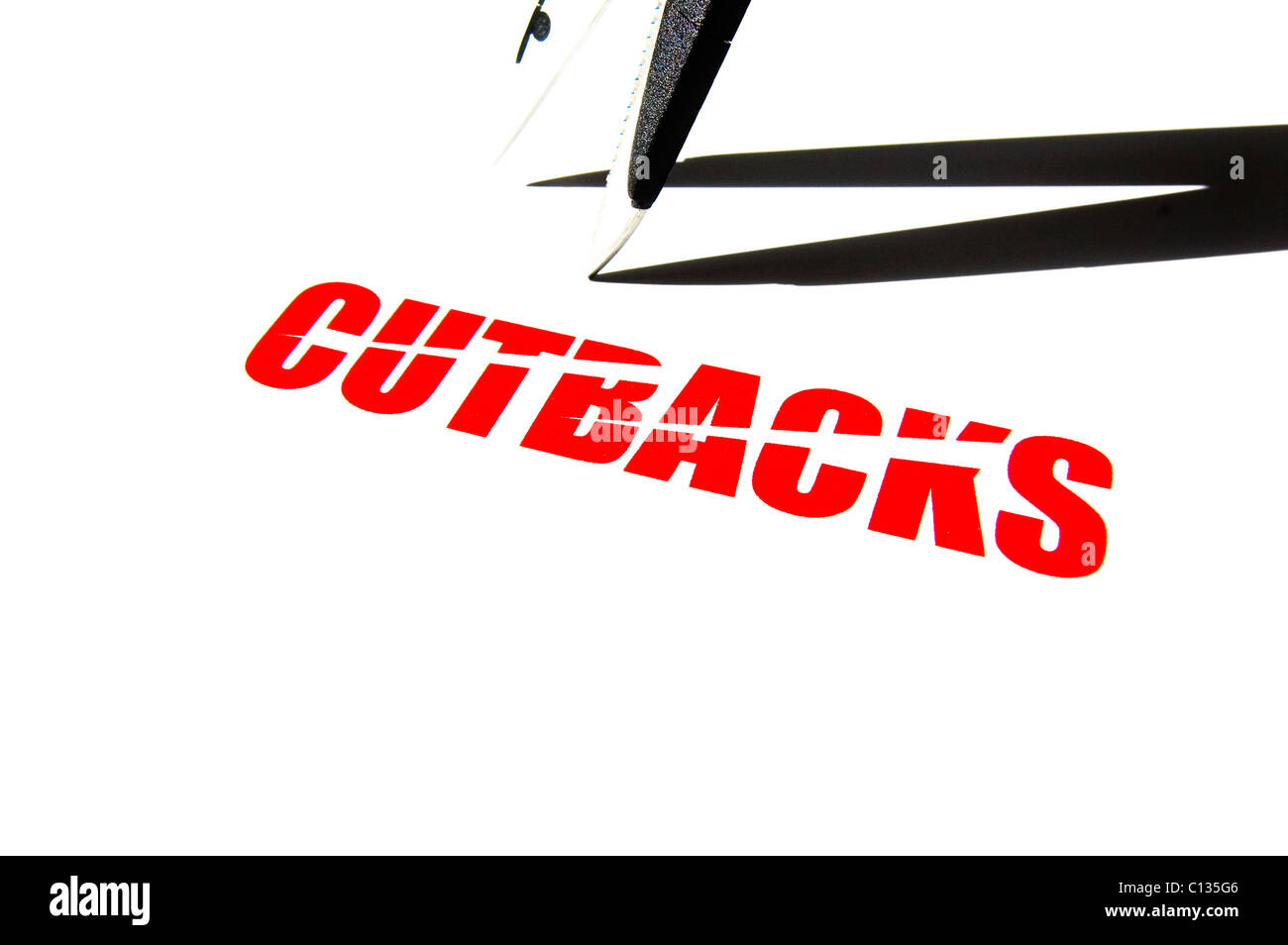 Stark high contrast image of sharp scissors and the rough edge text