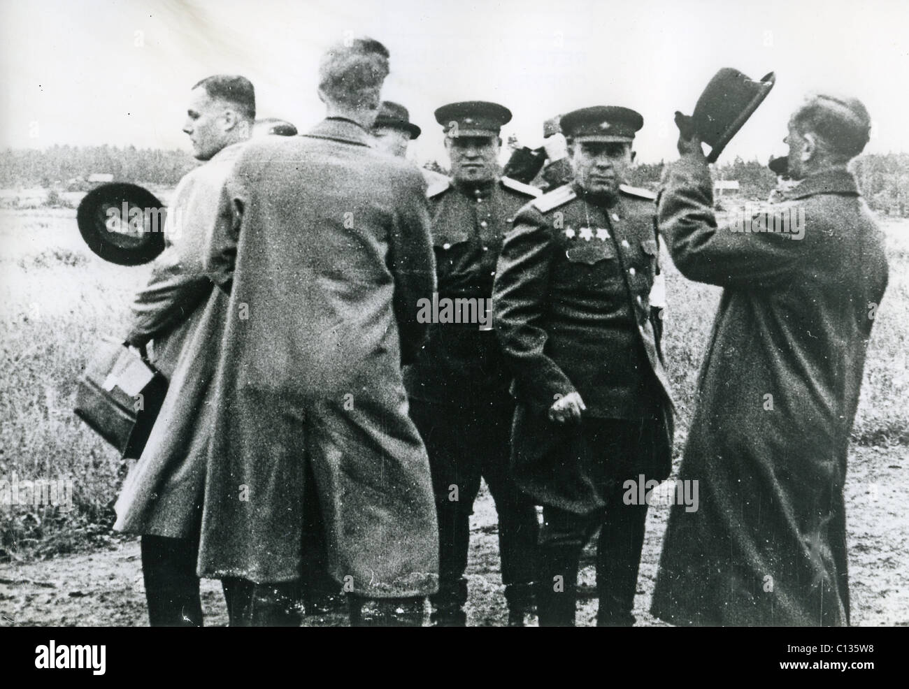 WINTER WAR 1939-1940 Finnish representatives prepare to travel to Moscow early March 1940 watched by Soviet officers Stock Photo