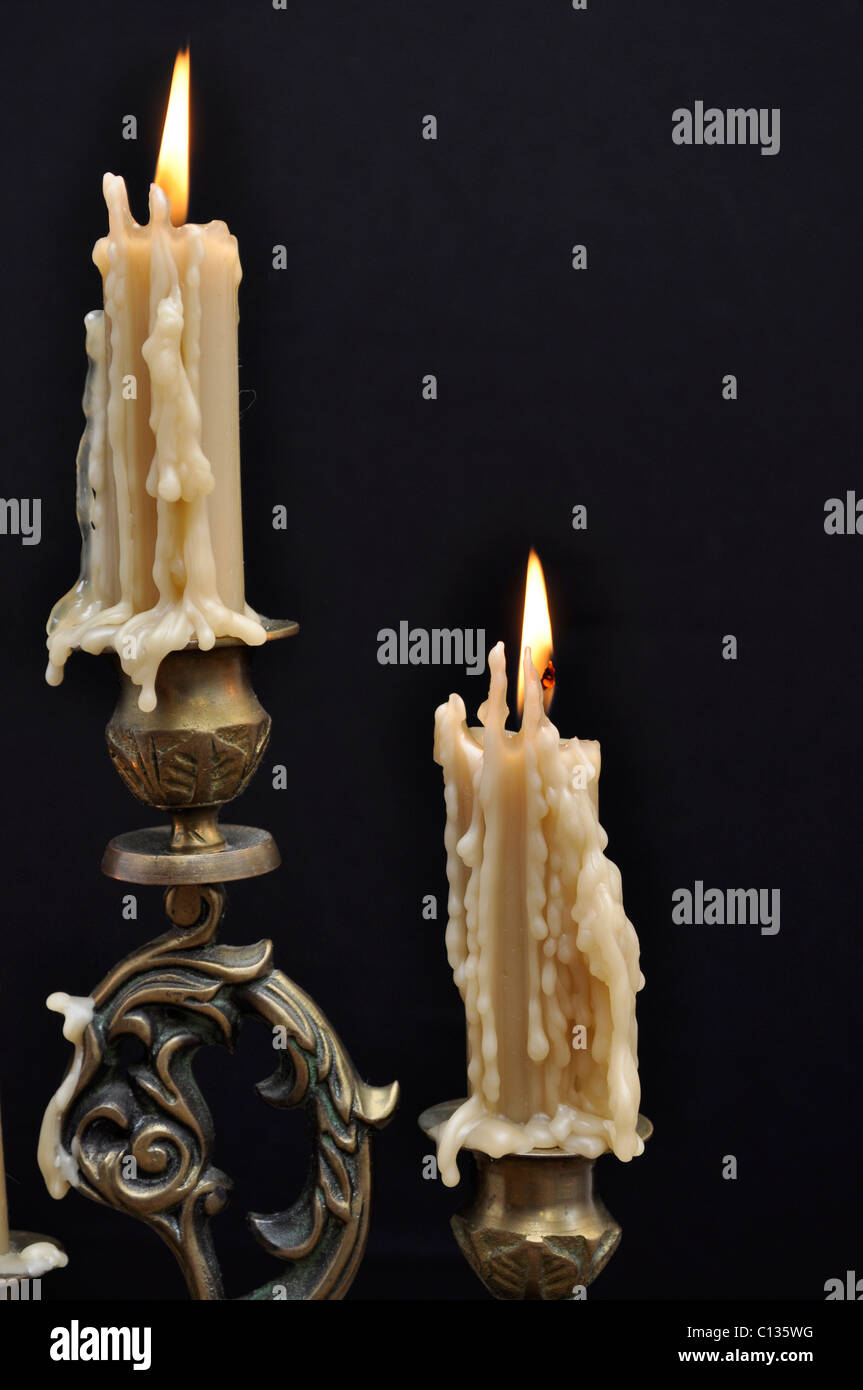 Two melting candles on black background Stock Photo Alamy