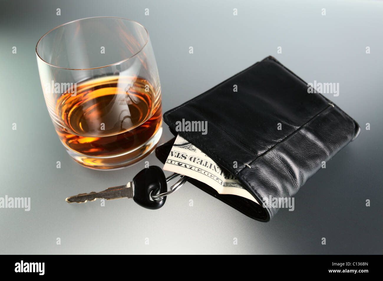 Whisky,money and key from car. Stock Photo