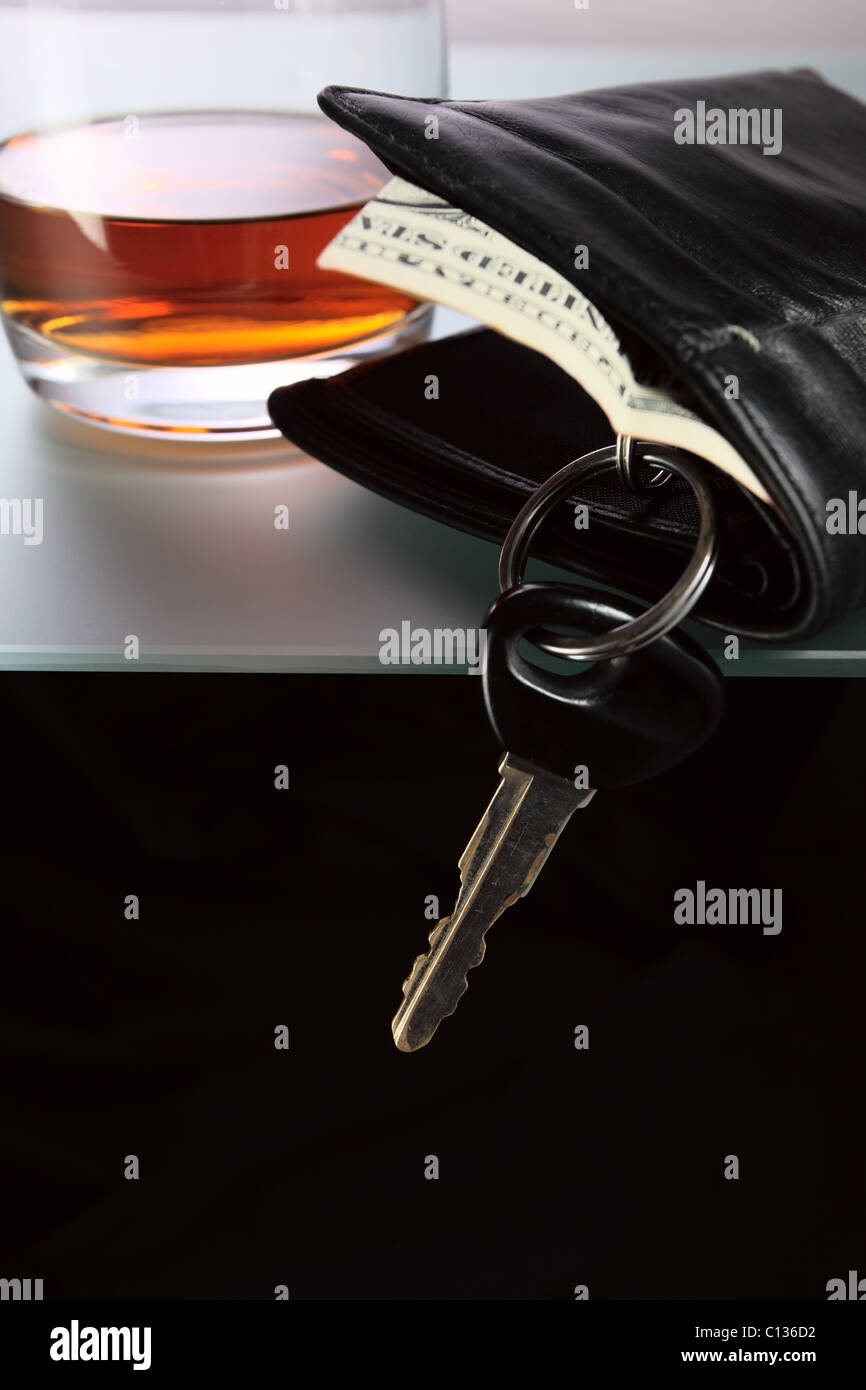 Whisky,money and key from car. Stock Photo