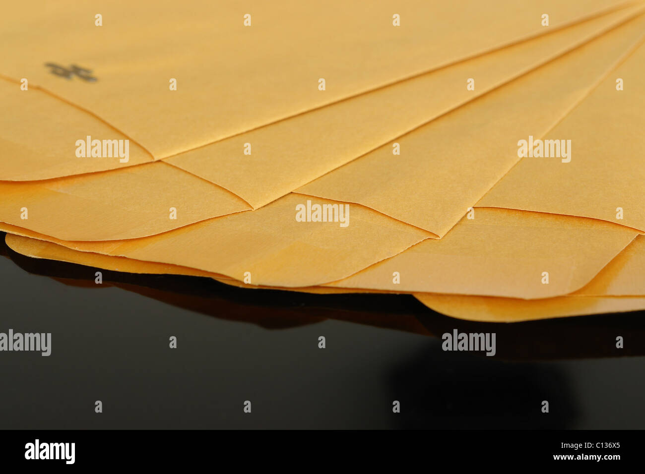 Array of yellow empty envelopes over black background Stock Photo