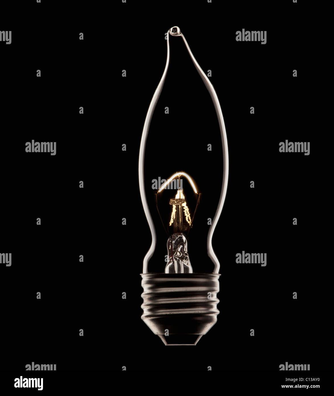 Energy saving bulb on black background, studio shot Stock Photo - Alamy