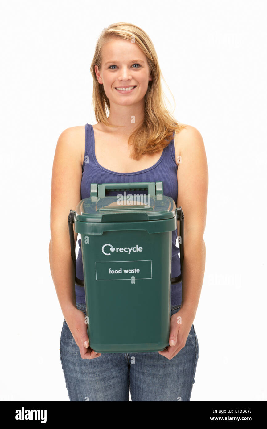 Young woman holding recycling container Stock Photo