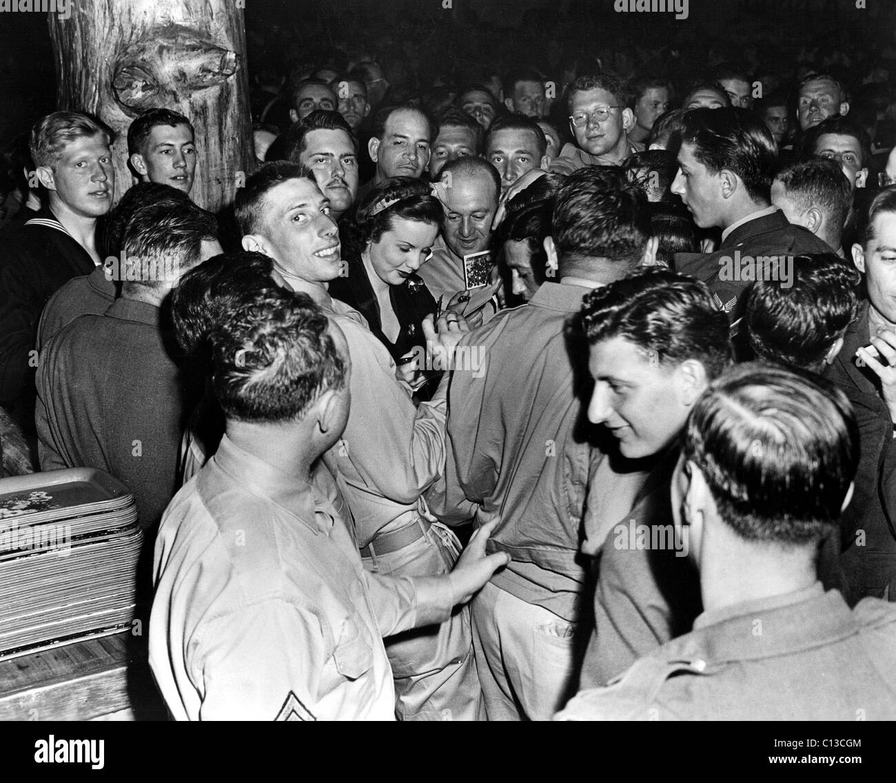 Deanna Durbin signing autographs at the Hollywood Canteen during World War II Stock Photo