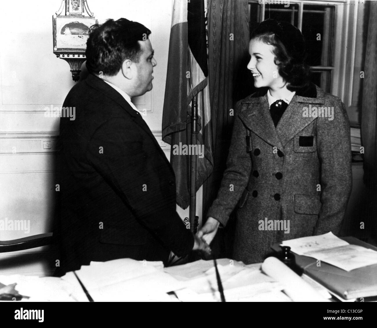 New York Mayor Fiorello LaGuardia greeting Deanna Durbin in his office, 1936 Stock Photo