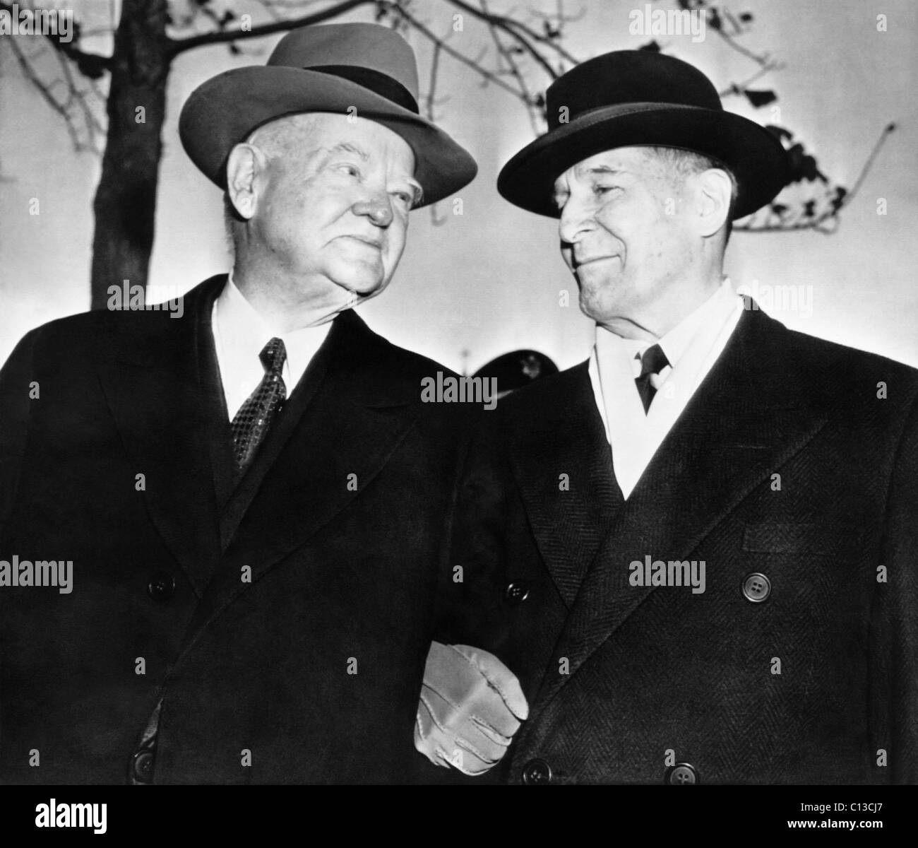 From left, former president Herbert Hoover, retired general Douglas MacArthur, at Governor's Island, New York, 1957 Stock Photo