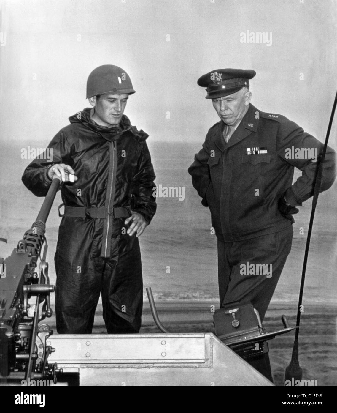 General George Marshall. From left: Lt. Eugene Garibaldi explains the operation of guns mounted on an amphibious tractor to Army Chief of Staff General George Marshall, Fort Ord, California, 1944 Stock Photo