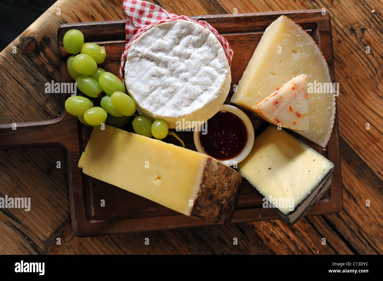 A selection of delicious cheeses for sale in Artisan Delicatessen restaurant Stock Photo
