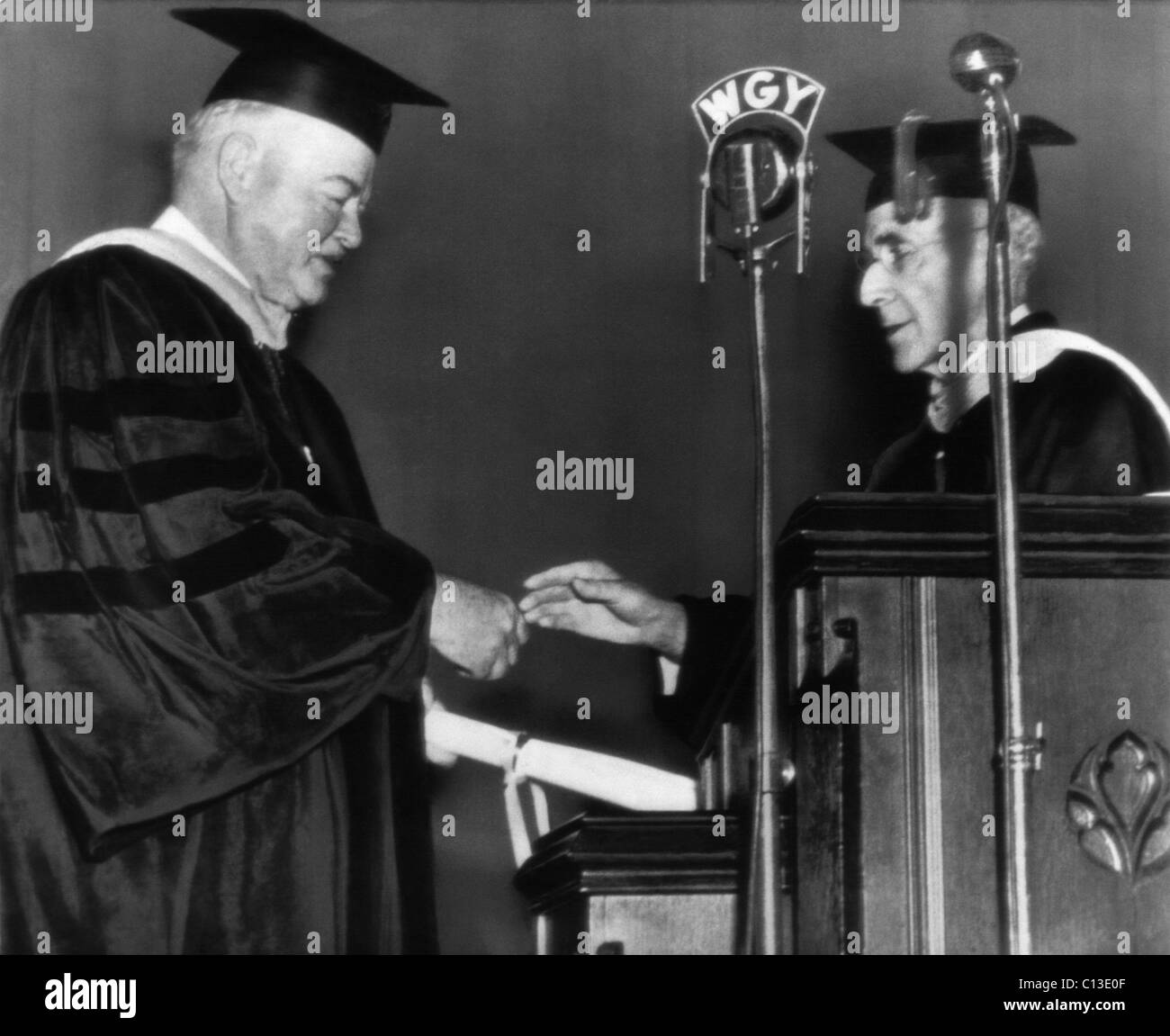 Former President Herbert Hoover, receives an honorary degree of Doctor of Engineering from Dr. John A. Ross Jr., President of Clarkson College of Technology, New York, October 8, 1945. Stock Photo