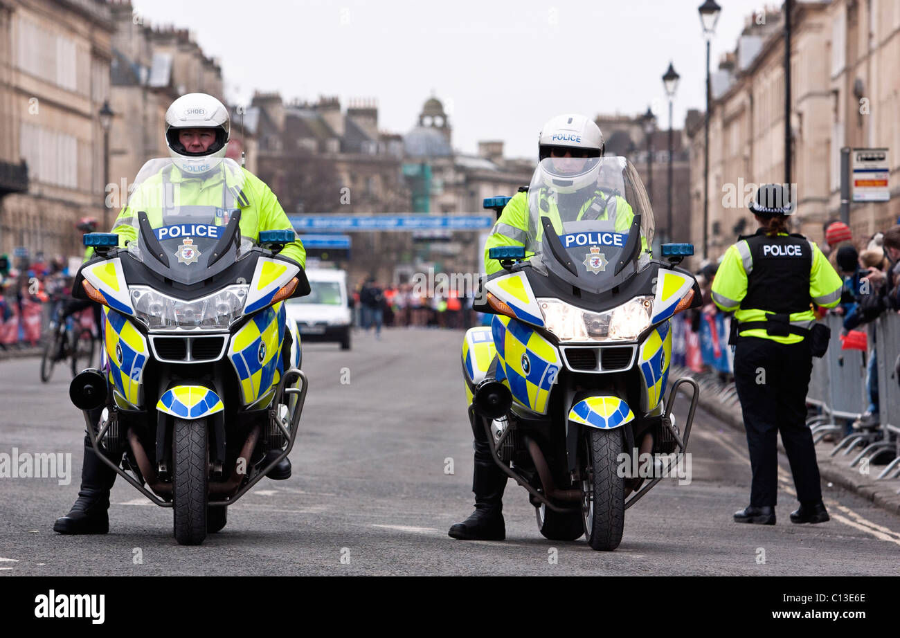 Two motorcycle police officers from Avon and Somerset police prepare to escort the runners at the 30th Bath Half marathon. Stock Photo