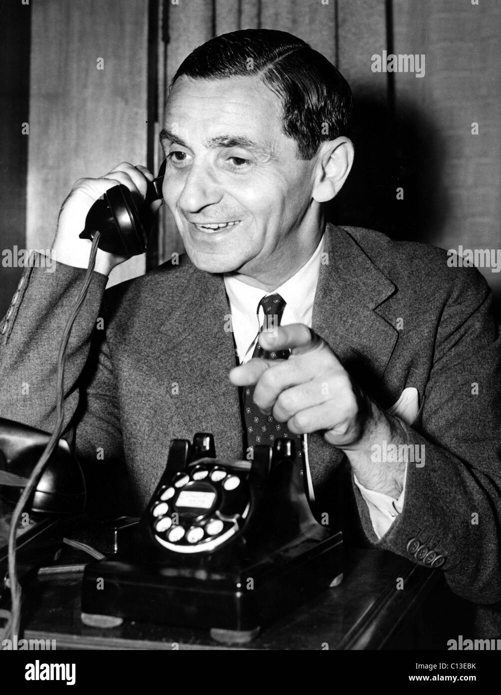 Irving Berlin listens to recording of the 'American Eagles' Number for his film THIS IS THE ARMY, 1943. Stock Photo