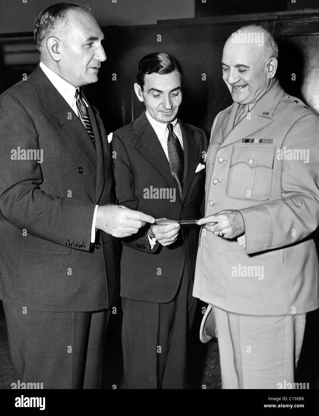 Irving Berlin receives down payment from Albert Warner for movie rights to THIS IS THE ARMY. Mr. Berlin turned the check over to General Irving J. Phillipson to help the war effort, 07-10-1942. Stock Photo
