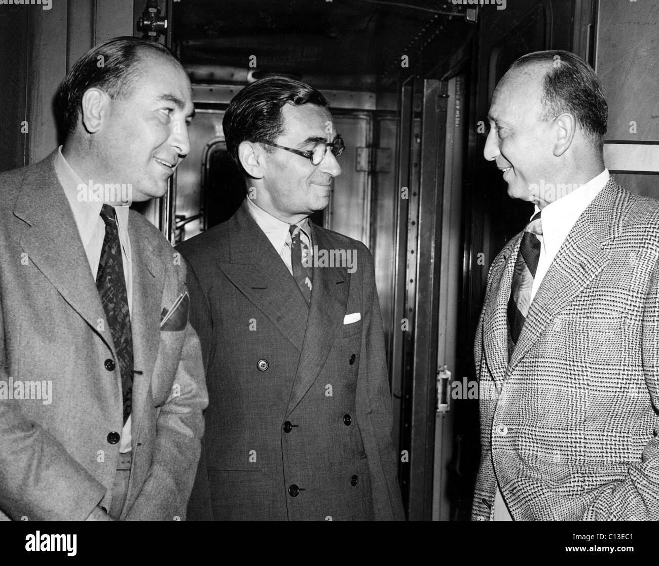 Irving Berlin, Michael Curtiz and Hal B. Wallis arrive at New York to prepare for the world premiere of THIS IS THE ARMY, New York, NY, 07-02-1943. Stock Photo